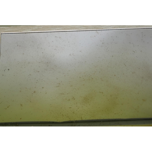 1036 - A painted and distressed wall mirror with a reeded frame and antiqued glass, 71 x 102cm