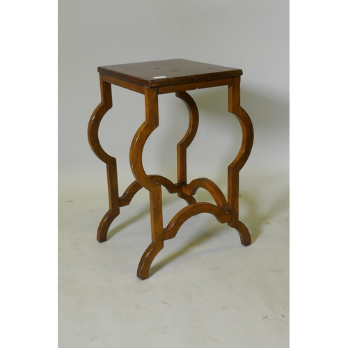 1037 - A continental mahogany lamp table, raised on shaped supports, 35 x 38 x 67cm