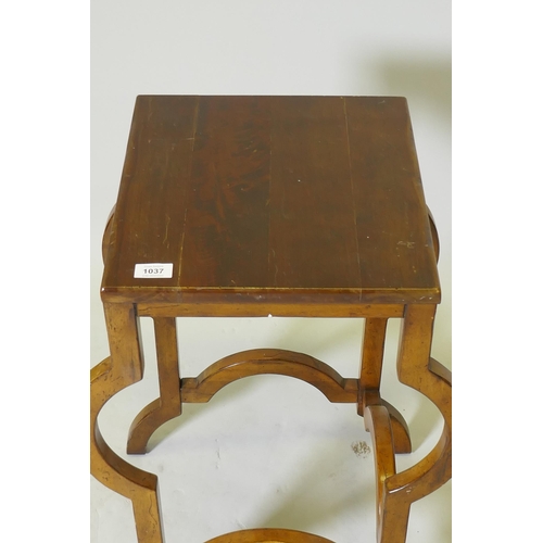 1037 - A continental mahogany lamp table, raised on shaped supports, 35 x 38 x 67cm