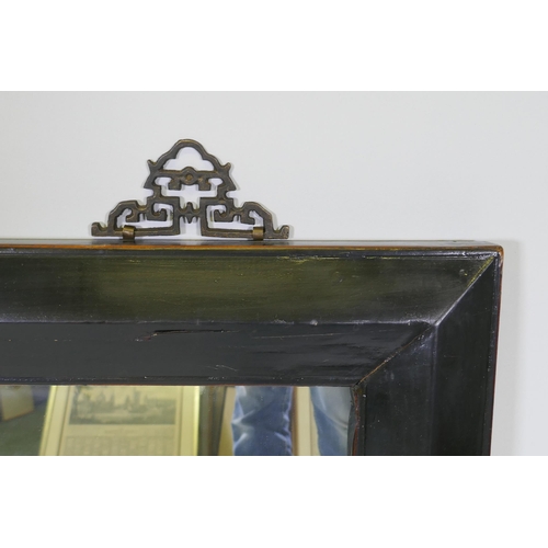 1038 - A Chinese black lacquer wall mirror with brass hangers, 100 x 80cm