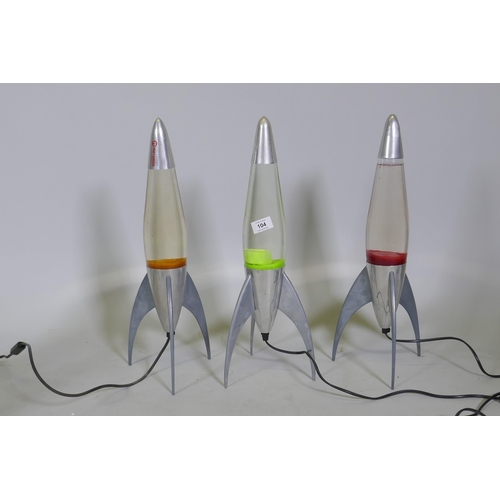 104 - Three Mathmos Telstar lava lamps, 50cm high, one top dented