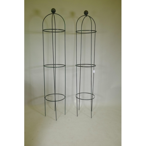 1040 - A pair of metal plant towers with ball finial, 192cm high