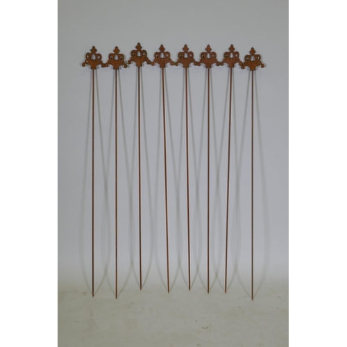 1041 - A set of eight cast iron gothic style plant stakes, 106cm long