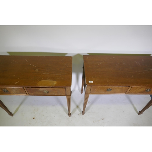 1042 - A pair of mahogany two drawer side tables on tapered and fluted legs, 91 x 46cm, 78cm high