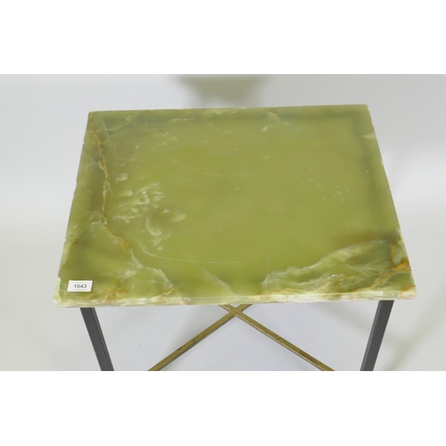 1043 - An onyx top occasional table raised on a painted metal base, 39 x 48 x 53cm