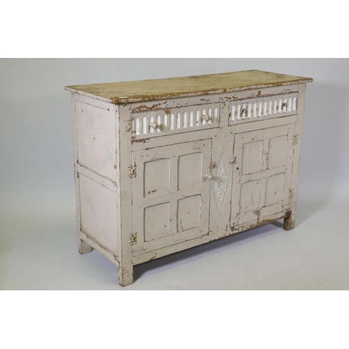 1049 - A vintage painted oak buffet/sideboard, with two drawers over two panelled cupboards, 130 x 48 x 92c... 