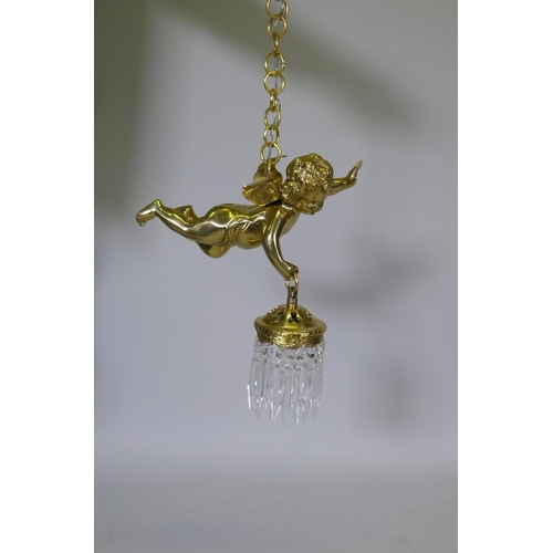 1052 - A pair of French style gilt metal pendant lights in the form of winged putti, with glass lustres, 60... 