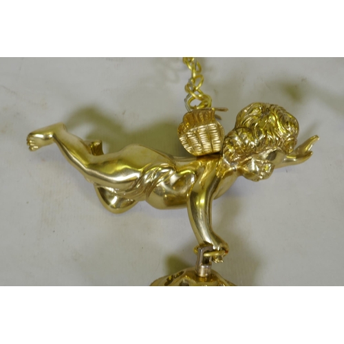 1052 - A pair of French style gilt metal pendant lights in the form of winged putti, with glass lustres, 60... 