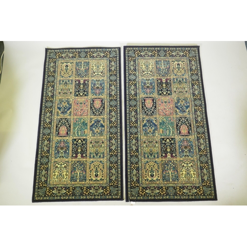 1053 - A pair of dark blue deep pile fine woven Persian runners with traditional panel designs, 85 x 160cm