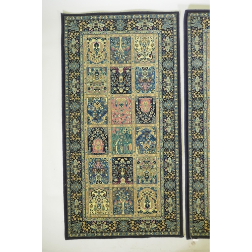 1053 - A pair of dark blue deep pile fine woven Persian runners with traditional panel designs, 85 x 160cm