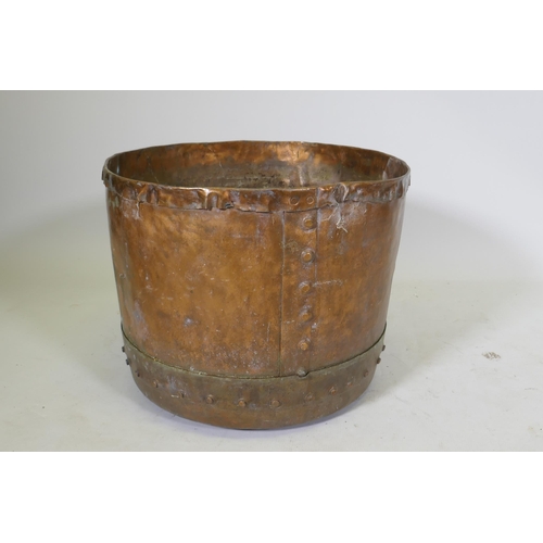 1064 - An antique copper jardiniere/planter of rivetted construction, 48cm diameter x 40cm high