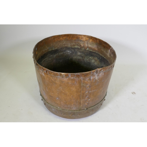 1064 - An antique copper jardiniere/planter of rivetted construction, 48cm diameter x 40cm high