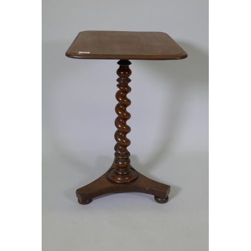 1075 - A C19th mahogany occasional table raised on a barleytwist column and platform base, with bun feet, 6... 