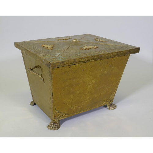 1076 - An Arts & Crafts brass sarcophagus shaped coal box raised on paw feet, 49 x 39cm