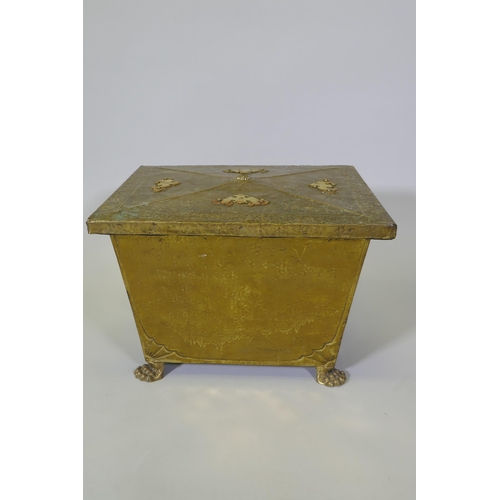 1076 - An Arts & Crafts brass sarcophagus shaped coal box raised on paw feet, 49 x 39cm