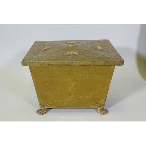 1076 - An Arts & Crafts brass sarcophagus shaped coal box raised on paw feet, 49 x 39cm