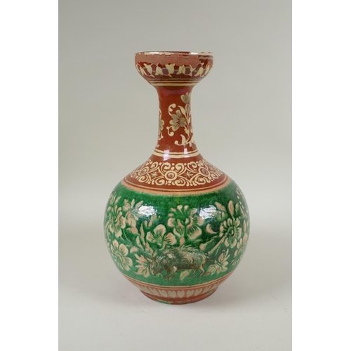 108 - An antique Islamic redware vase decorated with flowers and rodents, chips to glaze, 27cm high