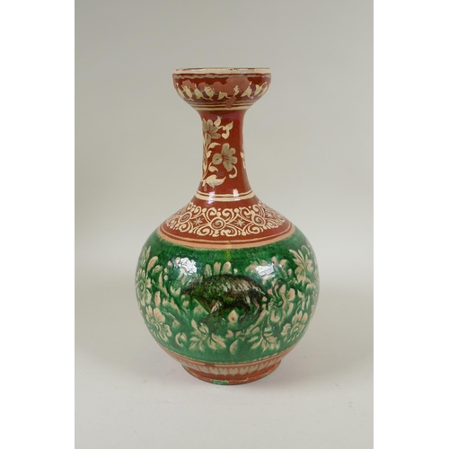 108 - An antique Islamic redware vase decorated with flowers and rodents, chips to glaze, 27cm high