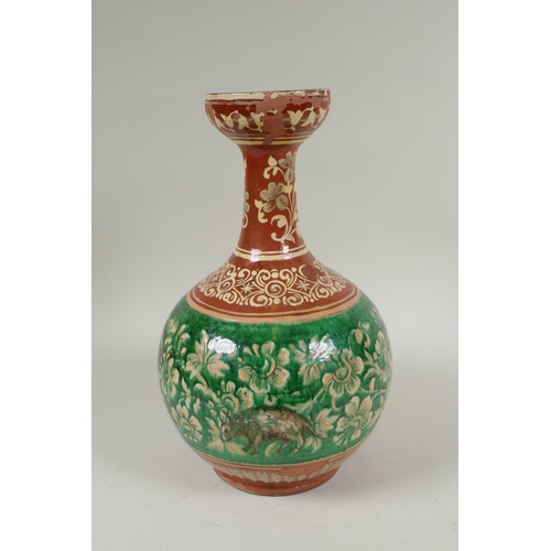 108 - An antique Islamic redware vase decorated with flowers and rodents, chips to glaze, 27cm high