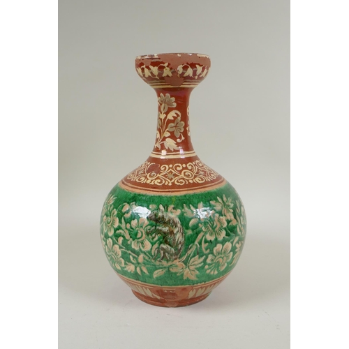 108 - An antique Islamic redware vase decorated with flowers and rodents, chips to glaze, 27cm high