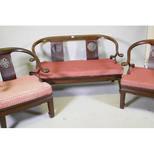 1082 - A Chinese hardwood settee with scroll arms, and matching armchairs