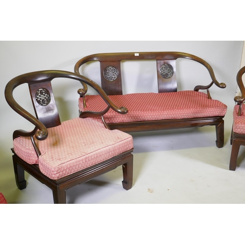 1082 - A Chinese hardwood settee with scroll arms, and matching armchairs