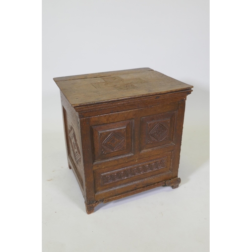 1083 - A C17th oak spice chest/coffer with carved panels, the cover dated 1691 and initialled MW, rear foot... 