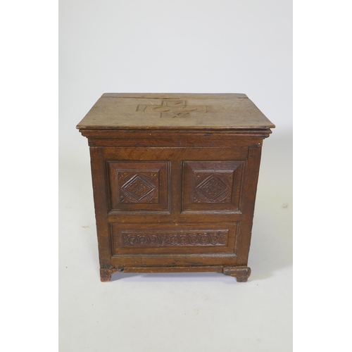 1083 - A C17th oak spice chest/coffer with carved panels, the cover dated 1691 and initialled MW, rear foot... 