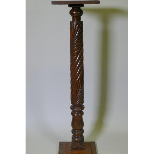 1091 - An antique Anglo Indian hardwood torchere with carved spiral leaf decoration to the column, 110cm hi... 