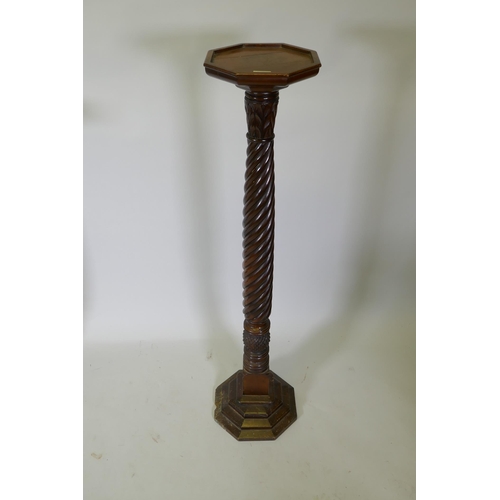 1092 - An antique carved hardwood torchere on a spiral column, 130cm high