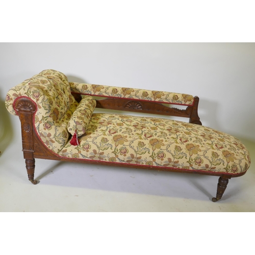 1093 - A Victorian walnut chaise longue with carved Grecian style decoration and good upholstery, 180cm lon... 