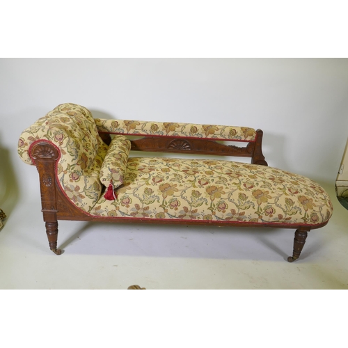 1093 - A Victorian walnut chaise longue with carved Grecian style decoration and good upholstery, 180cm lon... 