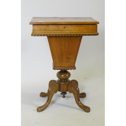 1100 - A Victorian inlaid walnut workbox, the rising top revealing a fitted interior, raised on carved cabr... 