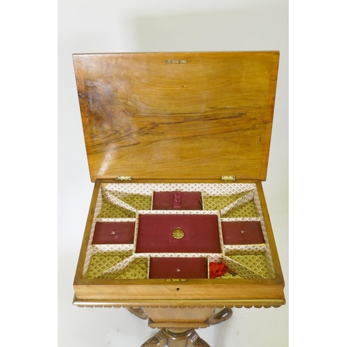 1100 - A Victorian inlaid walnut workbox, the rising top revealing a fitted interior, raised on carved cabr... 