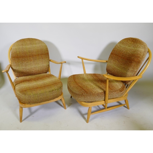 1101 - A pair of 1970s Ercol beech and elm Model 203 Windsor armchairs, with original upholstered cushions