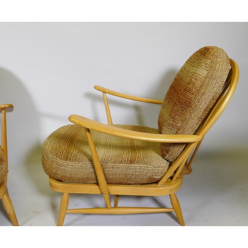 1101 - A pair of 1970s Ercol beech and elm Model 203 Windsor armchairs, with original upholstered cushions