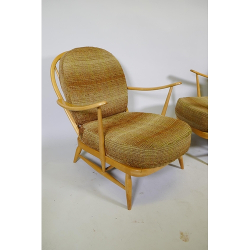 1101 - A pair of 1970s Ercol beech and elm Model 203 Windsor armchairs, with original upholstered cushions