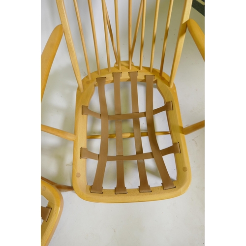 1101 - A pair of 1970s Ercol beech and elm Model 203 Windsor armchairs, with original upholstered cushions