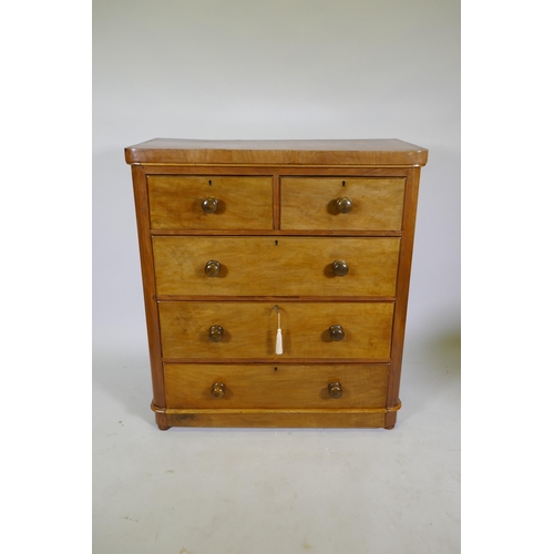 1104 - A Victorian mahogany chest of two over three drawers, frieze top and cushion drawer, and turned wood... 