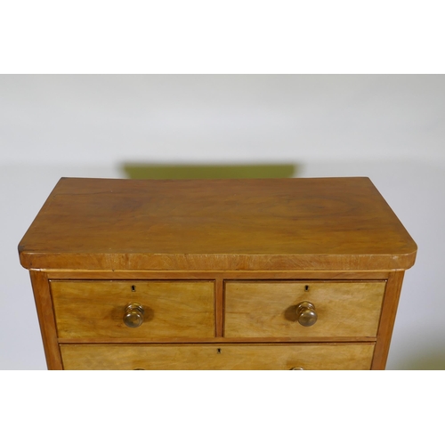 1104 - A Victorian mahogany chest of two over three drawers, frieze top and cushion drawer, and turned wood... 