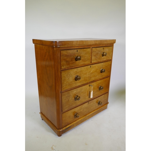 1104 - A Victorian mahogany chest of two over three drawers, frieze top and cushion drawer, and turned wood... 