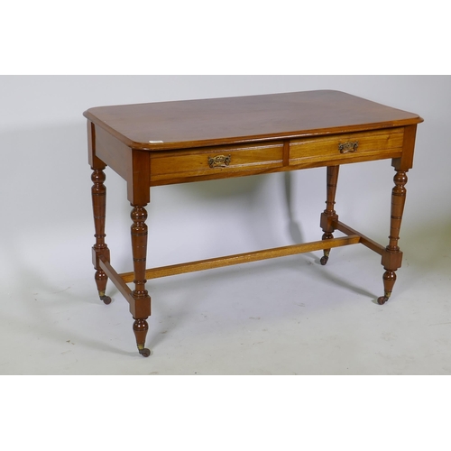 1109 - A Victorian mahogany two drawer writing table, raised on tapering supports untied by an H stretcher,... 