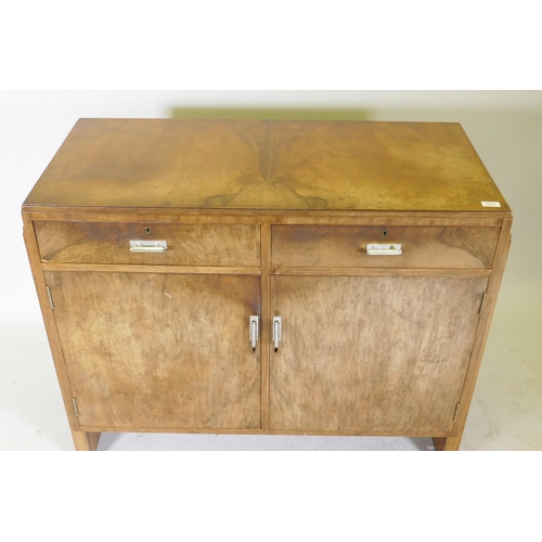 1111 - An Art Deco walnut odeon style buffet/sideboard, two drawers over cupboards and original chromed han... 