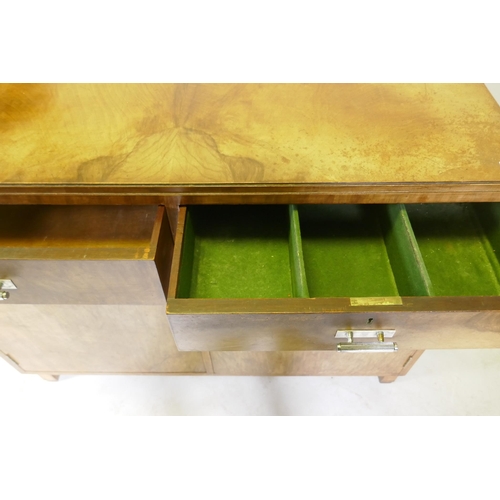 1111 - An Art Deco walnut odeon style buffet/sideboard, two drawers over cupboards and original chromed han... 