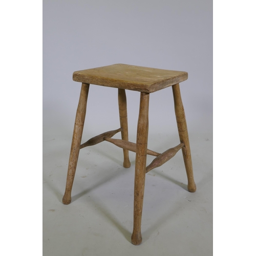 1114 - A C19th blond elm rustic stool, 54cm high