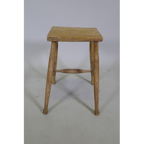 1114 - A C19th blond elm rustic stool, 54cm high