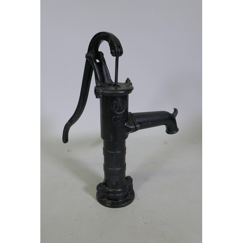 1115 - A painted cast iron water pump, 65cm high