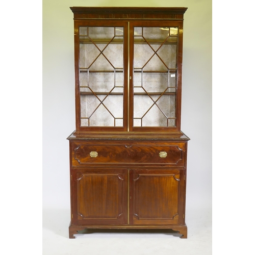 1118 - A George III mahogany secretaire bookcase, frieze top and dentil cornice over two astragal glazed do... 