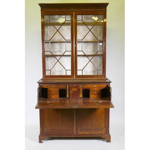 1118 - A George III mahogany secretaire bookcase, frieze top and dentil cornice over two astragal glazed do... 