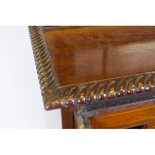 1118 - A George III mahogany secretaire bookcase, frieze top and dentil cornice over two astragal glazed do... 